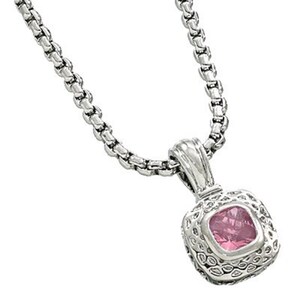 May include: A silver chain necklace with a square pendant featuring a pink gemstone.