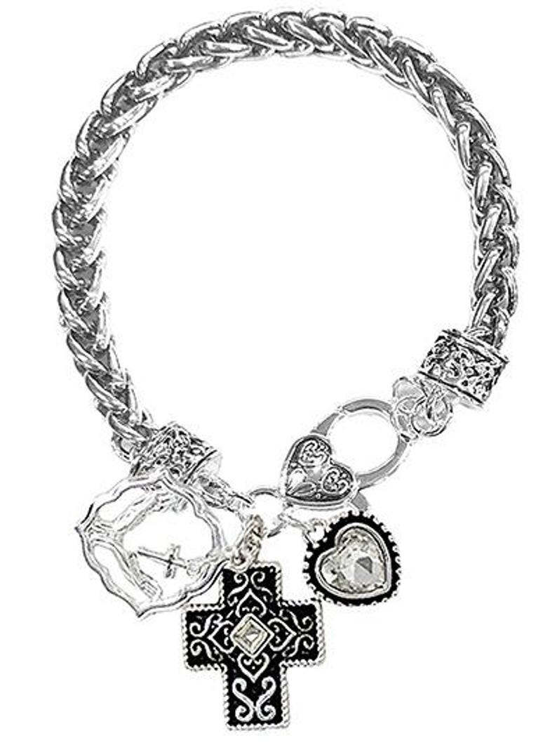 May include: Silver-toned bracelet with a braided chain design. The bracelet features decorative charms, including a cross, a heart, and a heart-shaped charm with a clear stone. The charms are detailed with intricate patterns.