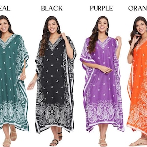 May include: Four kaftan dresses in teal, black, purple, and orange, each featuring a white paisley print, a V-neckline, and wide sleeves. The text labels TEAL, BLACK, PURPLE, and ORANGE appear above each respective garment in the display.