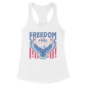 May include: White tank top with a blue and red graphic of an eagle with the text "FREEDOM IS NOT FREE" and stars.