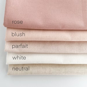 May include: Five fabric swatches in different shades of pink, beige, and white. The swatches are labeled "rose", "blush", "parfait", "white", and "neutral".