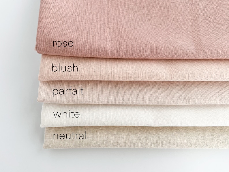 May include: Five fabric swatches in different shades of pink, beige, and white. The swatches are labeled "rose", "blush", "parfait", "white", and "neutral".