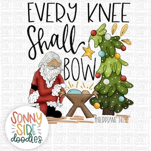 May include: A digital illustration of a Christmas scene with a black Santa Claus kneeling before a manger with a baby Jesus inside. A green Christmas tree with red and yellow ornaments is in the background. The text "EVERY KNEE SHALL BOW" is above the scene and "PHILIPPIANS 2:10" is below the scene.