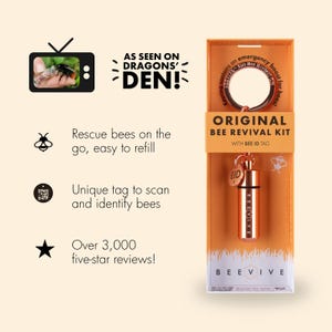 May include: An Original Bee Revival Kit in orange packaging featuring a copper-colored metal canister keychain with a Bee ID tag. The box displays text including As Seen On Dragons' Den, Beevive, and information about rescuing bees on the go.