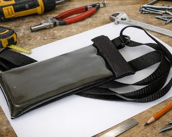Bolsa impermeable para teléfono móvil con correa ajustable antirrobo.