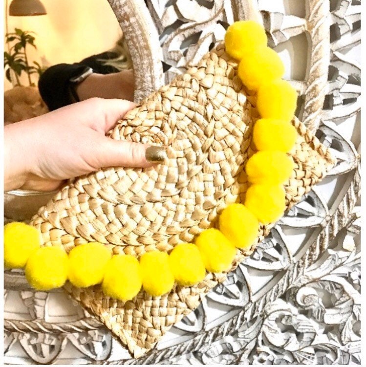 Straw clutch bag with pom poms deals