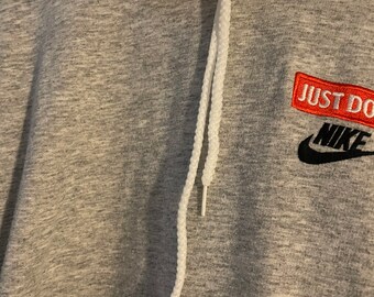 grey nike hoodie with red tick