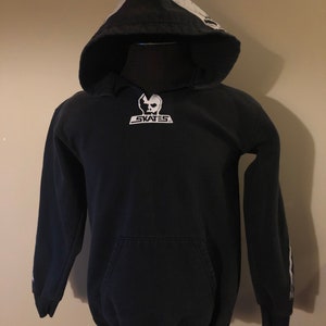 May include: Black hooded sweatshirt with a white skull graphic on the hood and a white skull logo on the front that says "SKATES".