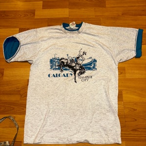 Camiseta vintage de Calgary Stampede, años 90, estilo rodeo, manga corta, vaquero, jinete de Bronco, 8 Seconds