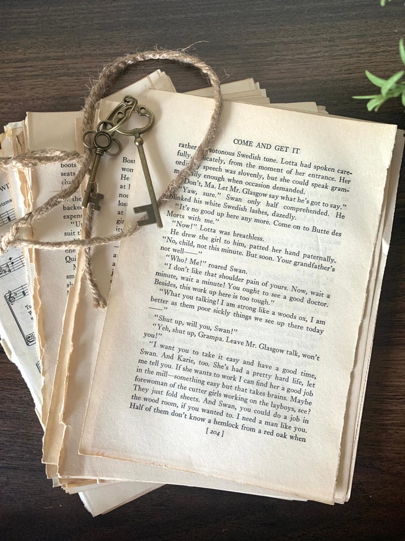 May include: A stack of vintage books with a brass key on top. The books are yellowed and worn with age. The text on the top book reads "Come and Get It".