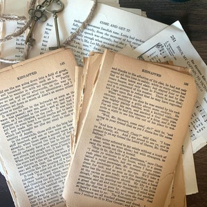 May include: A stack of vintage books with yellowed pages and worn edges. The books are tied together with twine. The top book has the title "Come and Get It" and the bottom book has the title "Kidnapped".