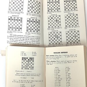 May include: A chessboard with black and white squares, showing the positions of the pieces in a game of chess. The text "Sicilian Defense" is visible in the bottom right corner of the image.