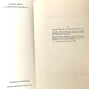 May include: A book titled "Chess Games Quickly" with copyright information from 1950, 1956, and 1957. The book was designed by Fred Reinfeld and printed and bound in the U.S.A.