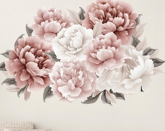 May include: A peel and stick wall decal featuring a cluster of pink and white peonies with green leaves. The decal is shown applied to a wall above a wicker sofa in a living room setting.