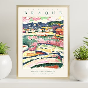 May include: A framed print of a painting by Georges Braque titled "Boats on the Beach at L'Estaque - 1906". The painting is a colorful abstract landscape with a focus on the boats and the beach.