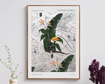 May include: A framed print with a black and white illustration of tropical leaves and a toucan. The print is titled "Flower Market" and is hanging on a white wall above a wooden cabinet with a green mesh front.