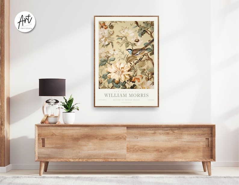 May include: A vintage-style poster featuring a floral design with a bird perched on a branch. The poster is titled "The Art of William Morris" and features a muted color palette of beige, brown, and green.
