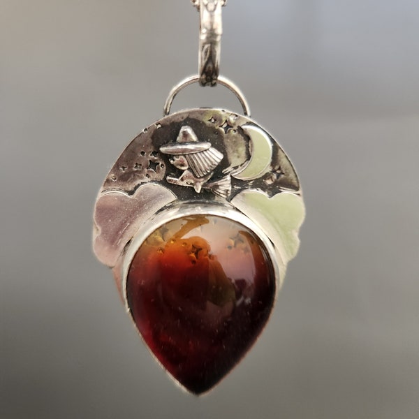 Baltic amber flying witch silver pendant