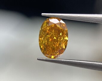 0.31 Carat Fancy Vivid Yellowish Orange Diamond Oval Modified Brilliant Diamond Shape 100% Natural GIA CERTIFIED Diamond