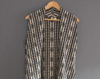 Cárdigan sin mangas blanco y negro (talla XS/S)