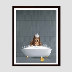 May include: A brown orangutan with a white soapy hat sits in a white bathtub with bubbles. A yellow rubber ducky sits on the edge of the tub.