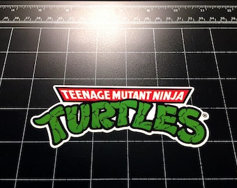 TMNT Teenage Mutant Ninja Turtles 80s toy logo sticker decal 80s cartoon 1980s toys