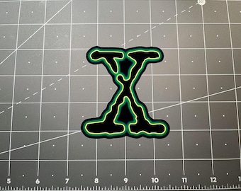 X Files green X logo decal sticker 90s nostalgia tv show movie Fox Mulder Dana Scully flying saucer UFO alien Area 51 sci fi aliens