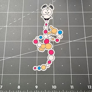 May include: A colorful sticker featuring a cartoon character with a smiling face and a body composed of connected circles. The circles are in shades of pink, blue, yellow, and white. The character has arms and is pointing.