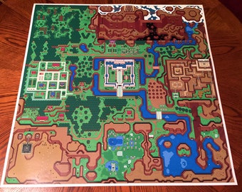 May include: A detailed map of the overworld from the classic Nintendo game The Legend of Zelda. The map features a variety of terrain, including forests, mountains, rivers, and lakes. The map is printed on a white background.