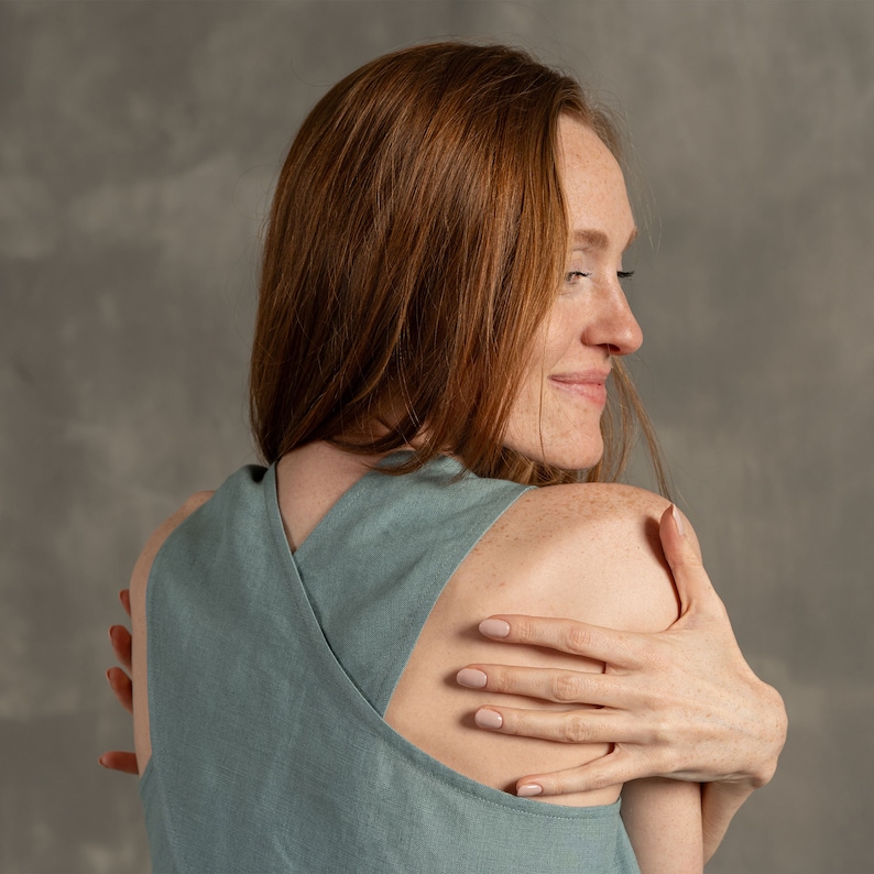 Tall women with red hair wearing Linen crop top blouse with cross back and classic Linen pants Lotus