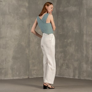 Tall women with red hair wearing Linen crop top blouse with cross back and classic Linen pants Lotus