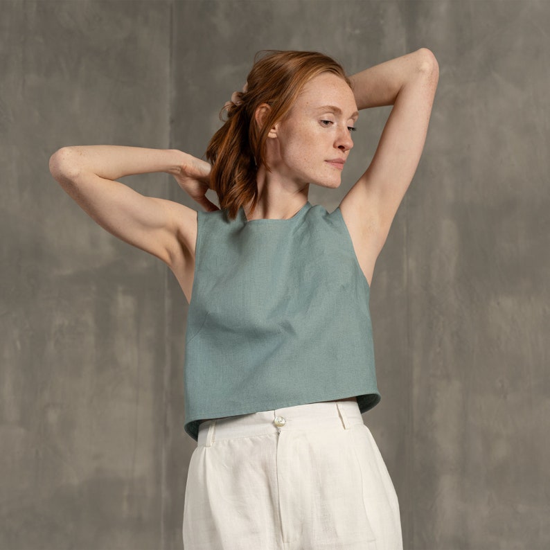Tall women with red hair wearing Linen crop top blouse with cross back and classic Linen pants Lotus