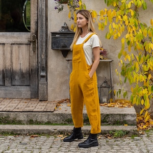 In the photograph the model is wearing the linen jumpsuit NICCI in spicy yellow color.
