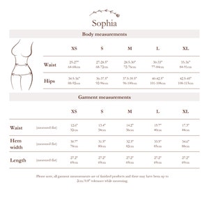 May include: Size chart for clothing with measurements in inches and centimeters. The chart includes sizes XS, S, M, L, and XL. Measurements are provided for waist and hips, as well as garment measurements for waist, hem width, and length.