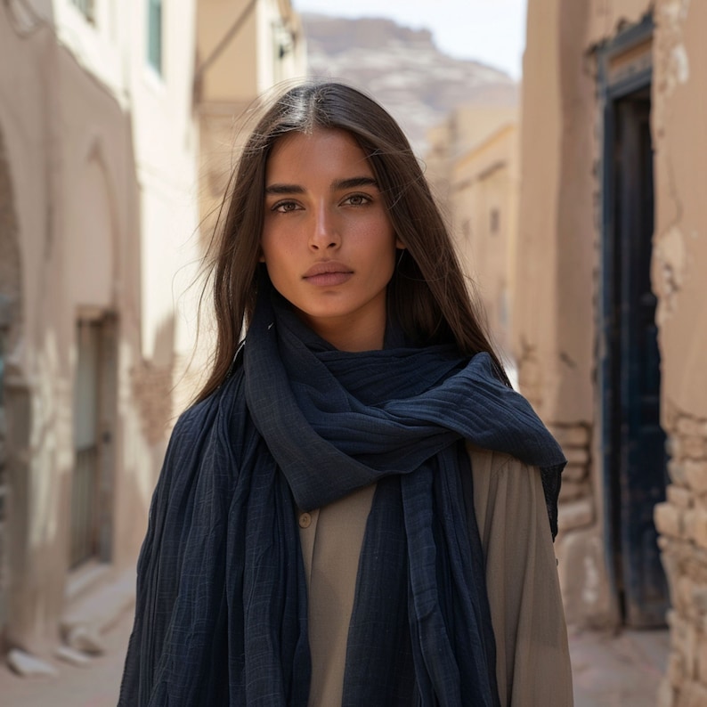 Woman wearing linen scarf in storm blue color