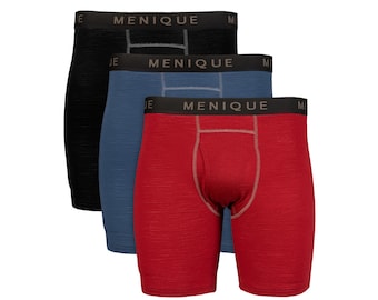 May include: Three pairs of boxer briefs in black, blue, and red. Each pair has a contrasting waistband with the brand name "MENIQUE" in white. The briefs are made of a textured fabric.