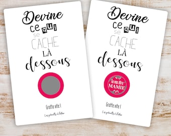 May include: Two white cards with pink scratch-off circles. The text on the cards reads "Devine ce qui se cache la dessous" and "Gratte vite! Les gribouillis d'Arthur". One card has the text "Tu vas être MAMIE" revealed under the scratch-off circle.