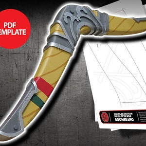 May include: A handcrafted boomerang prop with a yellow and brown body, accented with silver and red details. The prop is designed with a curved shape and includes a PDF template for construction. The text "PDF TEMPLATE" is visible in a red circle.