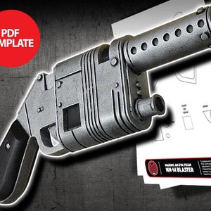 May include: A silver and black foam blaster prop, with a detailed design and a textured surface. The prop is based on the "Making an EVA Foam  MN-14 Blaster" instructions.