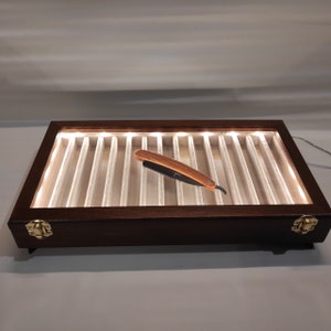 Display with LED light box for collectible freehand razors