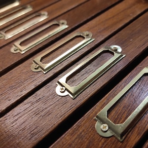 Iron plate for label holder drawers