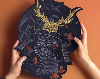 May include: Embroidered patch featuring a samurai helmet design with an owl motif. The patch is primarily black with gold and gray accents, and orange leaf details. The design is intricate and detailed, suitable for jackets or bags.