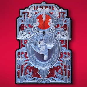 May include: A blue and white decorative wall hanging with an intricate design featuring a bird, stars, and the text "Star of the Soul".