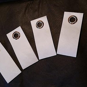 4 languettes à œillets autoadhésives pour bâches et bannières DuPont Tyvek