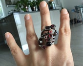 Silver snake ring and garnets