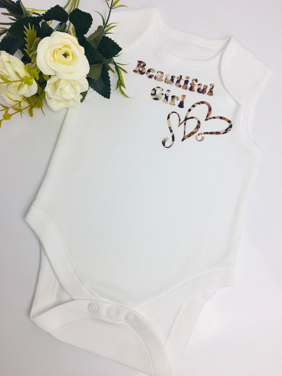 Lovely cosy printed babygrow in two designs.