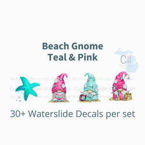 May include: Three beach gnome water slide decals. The gnomes are wearing teal and pink hats and have white beards. One gnome is holding a beach ball, one is holding a starfish, and one is holding a bucket and shovel.
