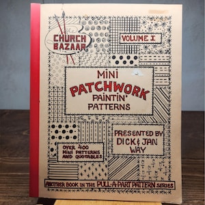 May include: A vintage book titled "Mini Patchwork Paintin' Patterns" with a red spine. The cover features a patchwork design with the text "The Church Bazaar" and "Volume I." The book is presented by Dick & Jan Way.