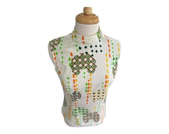 70s Sleeveless Turtleneck Blouse. White with Colorful  Geometric Pattern.