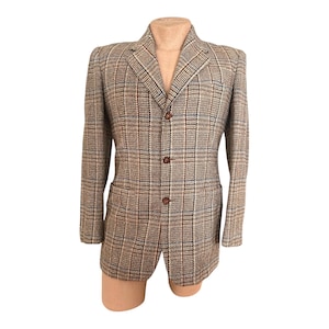 May include: A brown, blue, and white plaid blazer with three buttons. The blazer has a classic fit and a single-breasted closure.